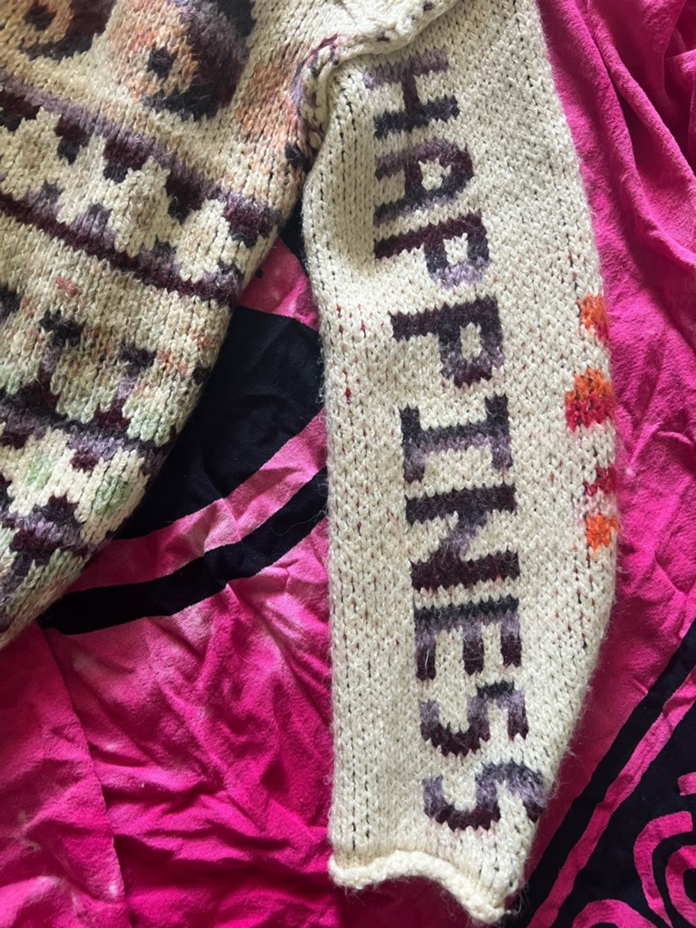 Handknit 'HAPPINESS' Cream Sweater Sleeve with Purple Lettering